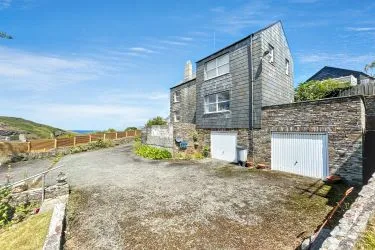 A Landmark Coastal Residence with Untapped Potential and Panoramic Sea Views!