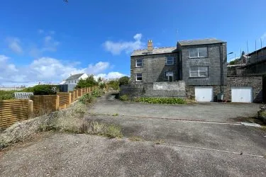 A Landmark Coastal Residence with Untapped Potential and Panoramic Sea Views!