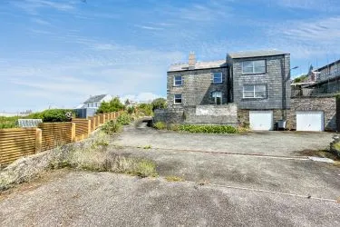 A Landmark Coastal Residence with Untapped Potential and Panoramic Sea Views!