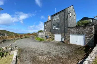A Landmark Coastal Residence with Untapped Potential and Panoramic Sea Views!