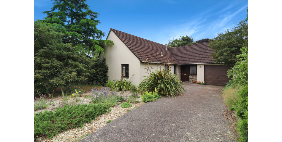 3 Bedroom detached bungalow in a peaceful village location with parking, garage and private wraparound gardens
