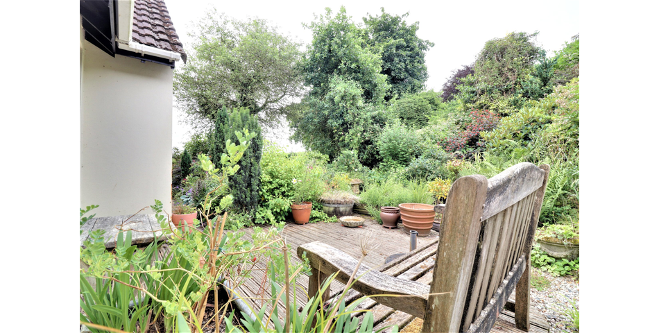 3 Bedroom detached bungalow in a peaceful village location with parking, garage and private wraparound gardens