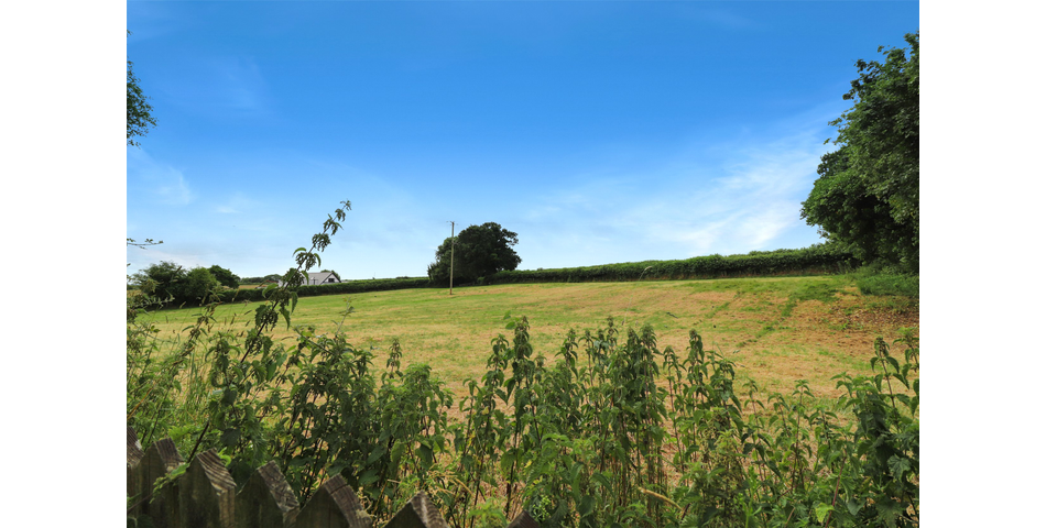3 Bedroom detached bungalow in a peaceful village location with parking, garage and private wraparound gardens
