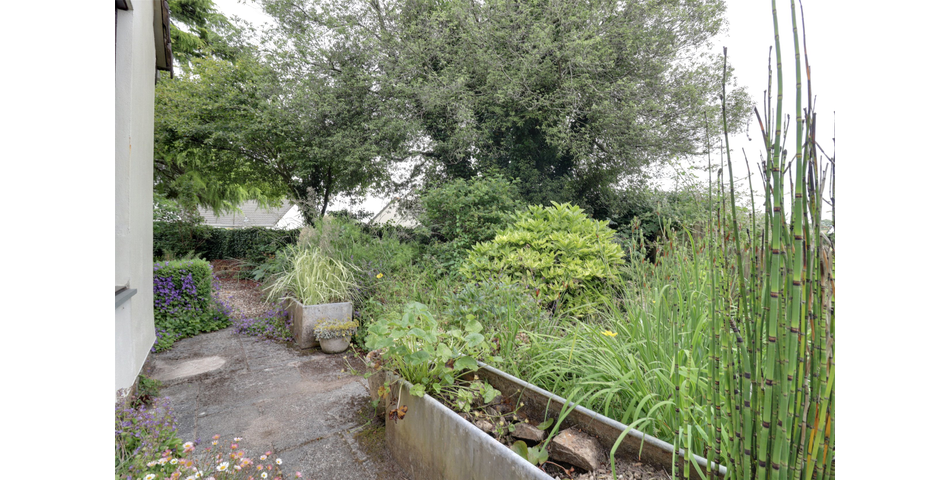 3 Bedroom detached bungalow in a peaceful village location with parking, garage and private wraparound gardens