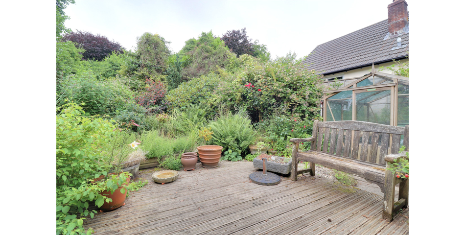 3 Bedroom detached bungalow in a peaceful village location with parking, garage and private wraparound gardens