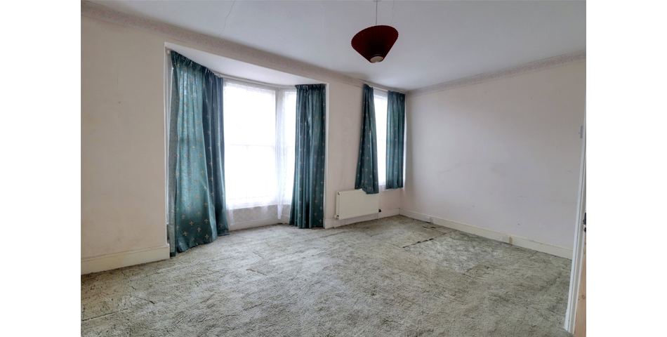 End terrace family home in need of modernisation and updating, centrally located and with the benefit of a garage and parking space