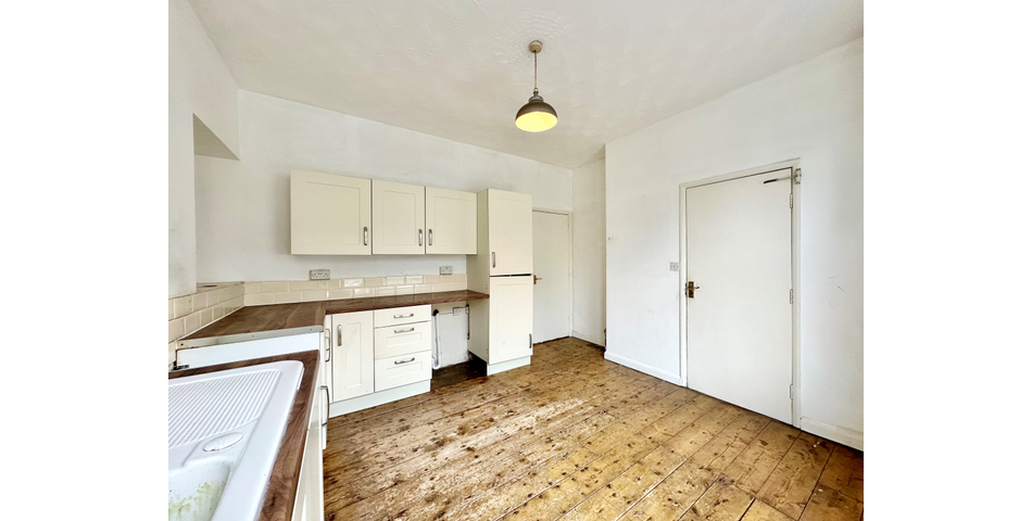 Spacious 2 bedroom maisonette, in need of modernisation and updating, situated in a central location, and having its own private area of garden