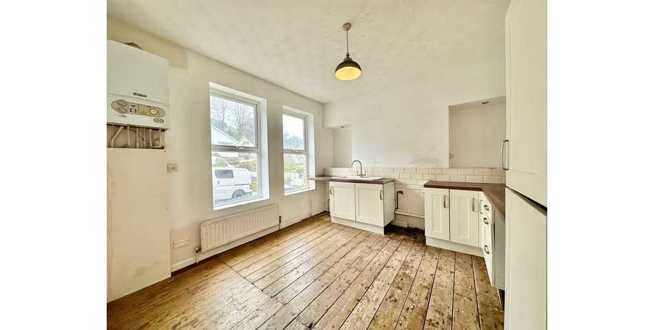 Spacious 2 bedroom maisonette, in need of modernisation and updating, situated in a central location, and having its own private area of garden