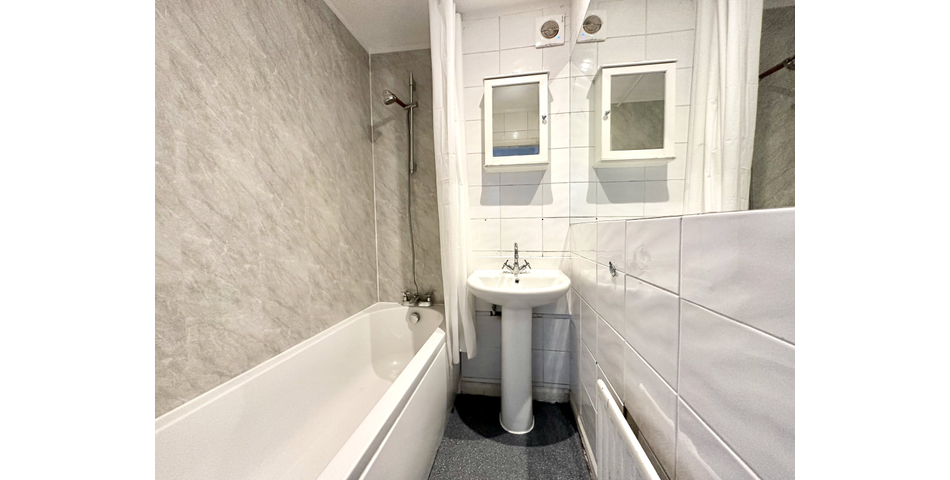 Spacious 2 bedroom maisonette, in need of modernisation and updating, situated in a central location, and having its own private area of garden