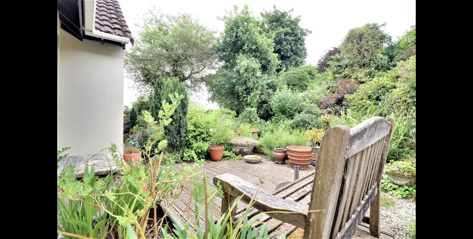 3 Bedroom detached bungalow in a peaceful village location with parking, garage and private wraparound gardens