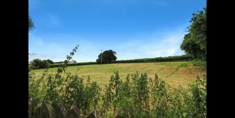 3 Bedroom detached bungalow in a peaceful village location with parking, garage and private wraparound gardens