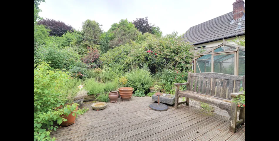 3 Bedroom detached bungalow in a peaceful village location with parking, garage and private wraparound gardens