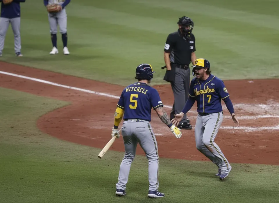 Brewers-spelers William Contreras en Garrett Mitchell vieren feest tijdens de World Series