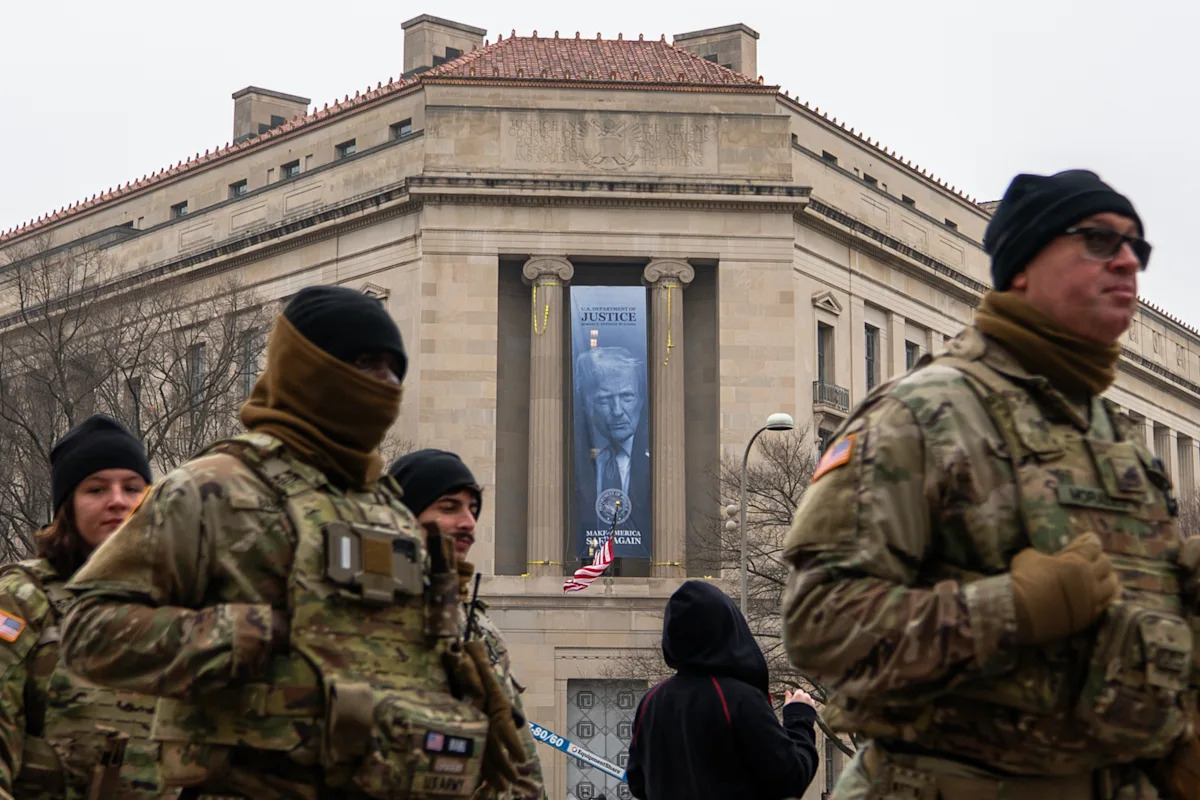 Banner with Trump's face displayed on Justice Department headquarters