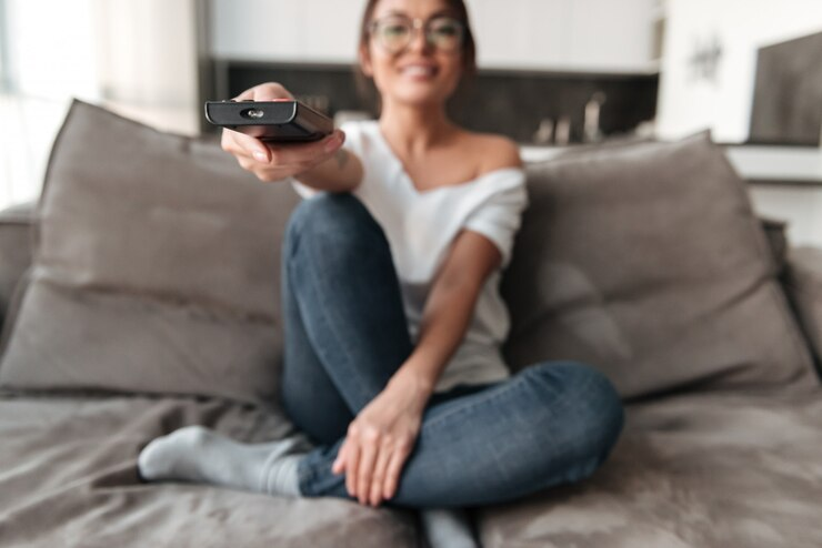 Woman Watching TV at Home