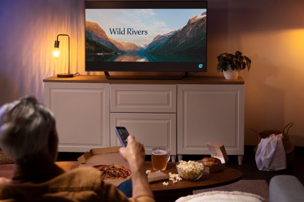 Man enjoying food while watching tv
