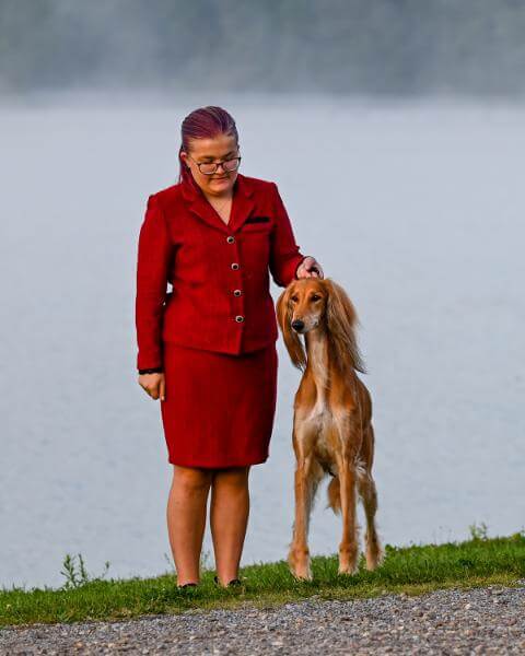 Mary Grace Kocab standing next to her dog.