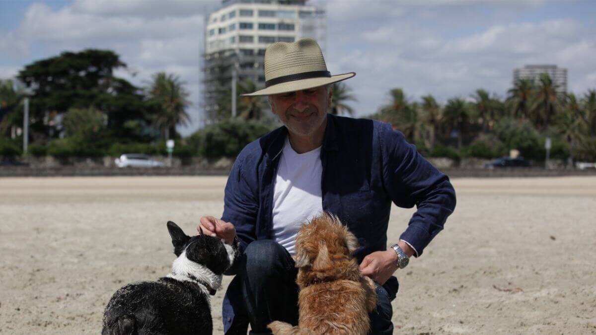 George pictured with Charlie The Boston (His CFO) and Mary the Griffon (His CMO)