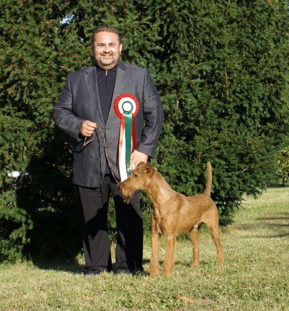 Hans E. Gruettner with an Irish Terrier.