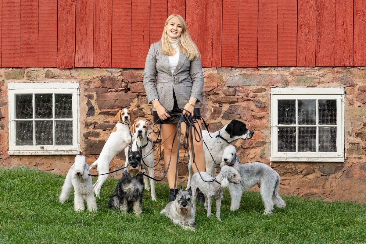 Lydia Frey with a pack of dogs