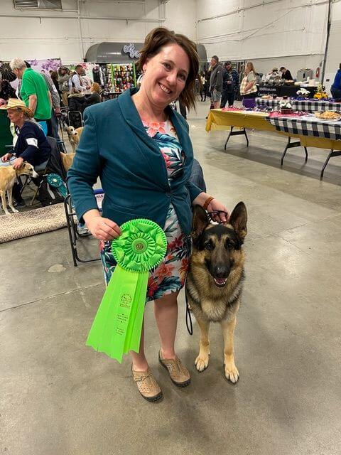 Veronica Dollar with herGerman Shepherd Dog at a dog show.