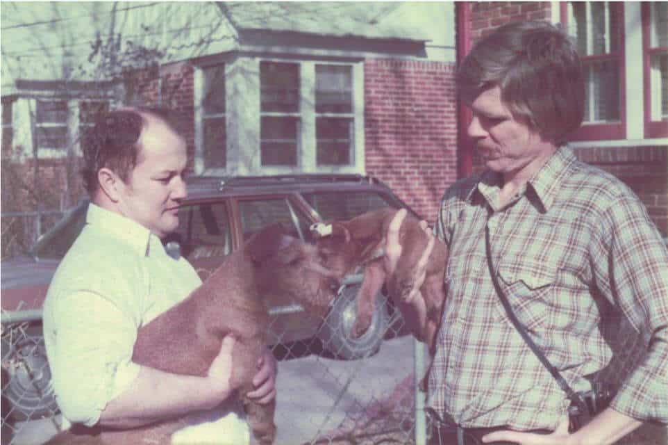 John Childers (l) and Ellis West (r) evaluate puppies in the 1970s.
