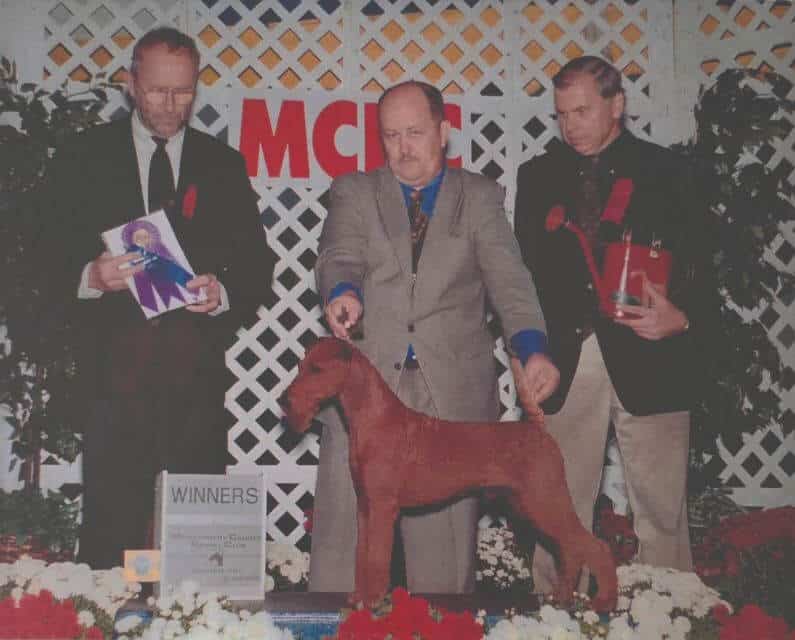 John going Winners Dog at Montgomery 1999 with Ch. Baystone Firehawk. Bobby Fisher is the Judge and ITCA President Bruce Petersen is presenting.