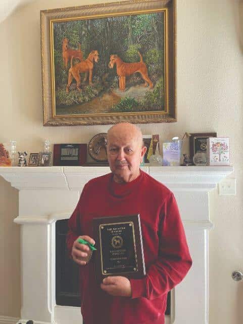 John with his ITCA Hall of Fame plaque presented to him in 2022.
