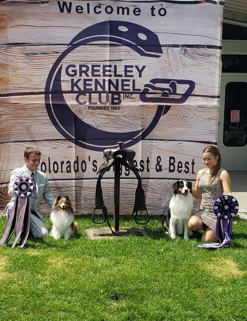 Best of the Best winners Owen Steffen (Reserve) and Anja Cikara-Gocke (Best Junior Handler) share the spotlight in Greeley. photo by Virginia Steffen