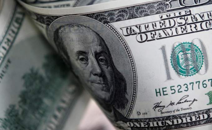 Dollar edges up against dong