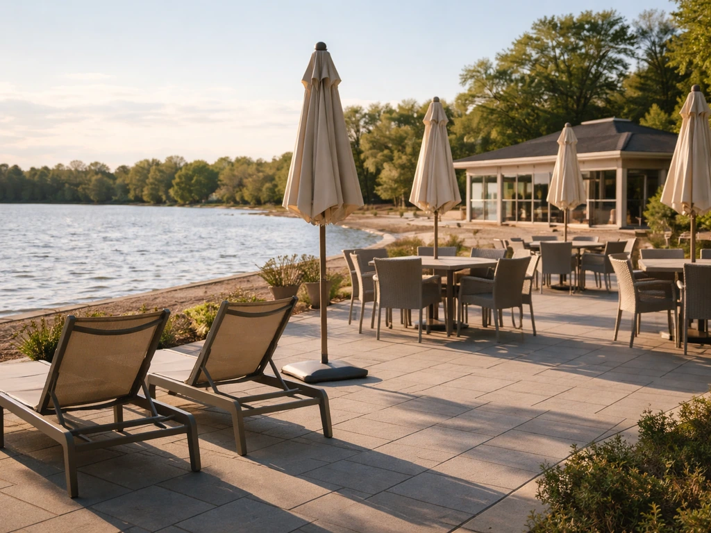 Early-season bay-side patio of Westboro Beach Club in Ottawa with umbrellas and calm waterfront beyond