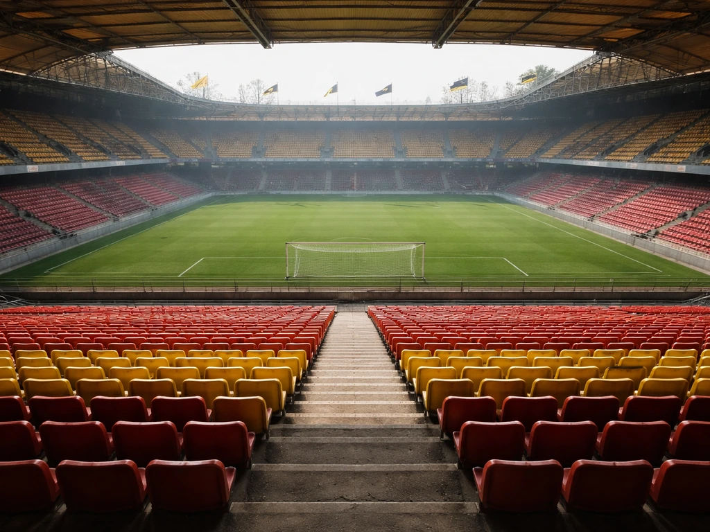 AEK Athens matchday: empty stadium seats and a distant goal under bright daylight.