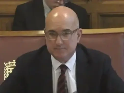 Angelos Marcelo Frangopoulos seated in a formal setting