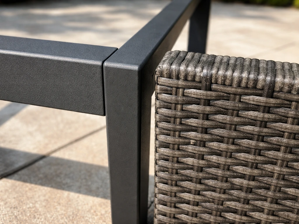 Side-by-side close-up of powder-coated aluminum outdoor chair frame and all-weather faux woven detail.