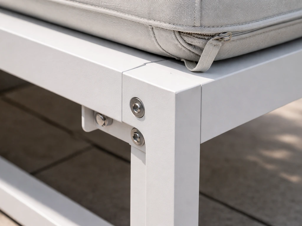 Close-up of a powder-coated aluminum frame joint with cushion stitching and hardware connection points.