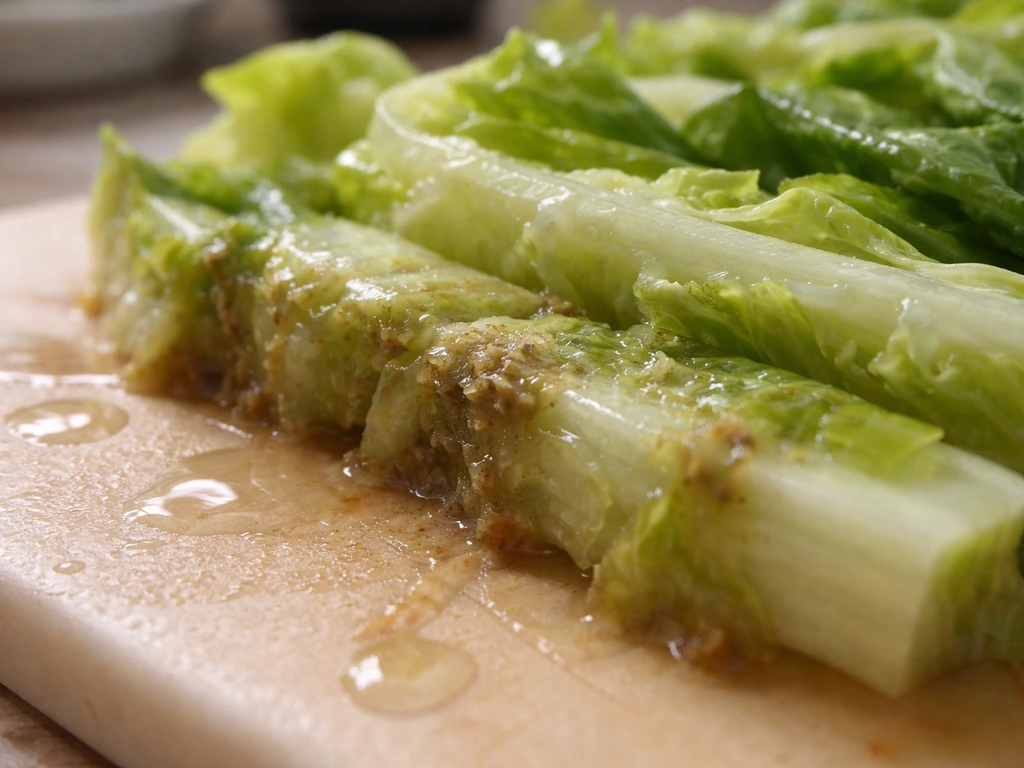 Close-up of moist produce surface with subtle biofilm-like texture suggesting bacterial colonization.