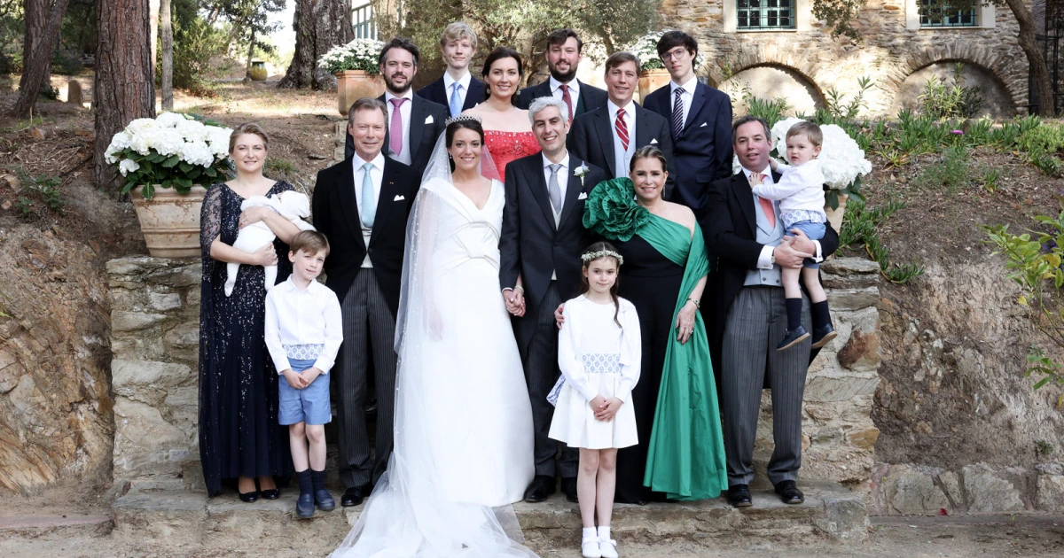 Group wedding photo featuring Princess Alexandra of Luxembourg and Nicolas Bagory with family members outdoors