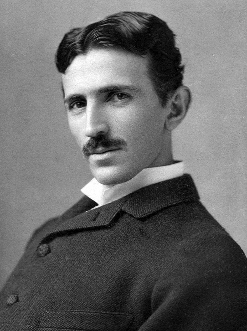 Black-and-white portrait photograph of Nikola Tesla in a suit, circa 1890.