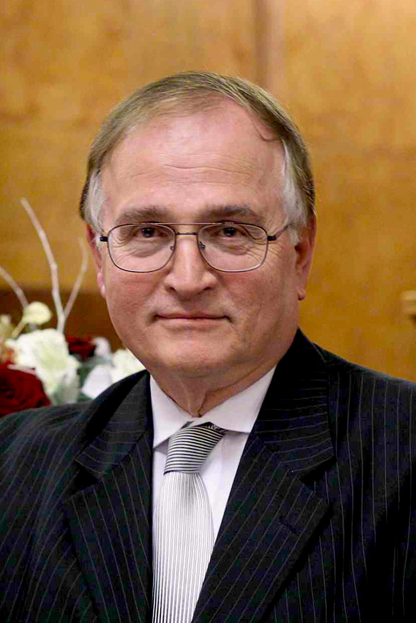 Portrait of Nicholas A. Peppas in a suit and tie