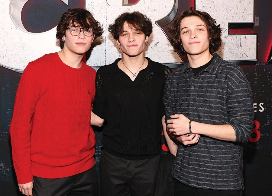The Sturniolo Triplets posing together at an event, with Nicolas Antonio Sturniolo among them.