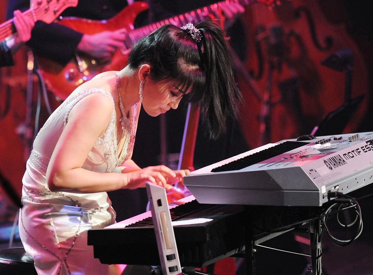Keiko Matsui performing on keyboard on stage