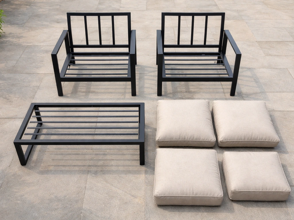 Grouped flat-lay of Amazon Basics patio set pieces: chair frames, cushions, and a coffee table on a patio.
