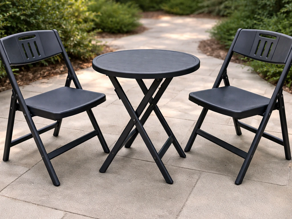 Close-up of a TAO ONE 3-piece plastic folding bistro set on patio, showing table and two chairs with no cushions.