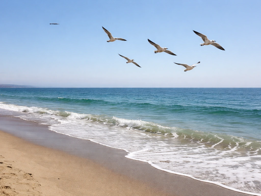 Seagulls flying above a calm Redondo Beach coastline with subtle bird symbolism in the sky.