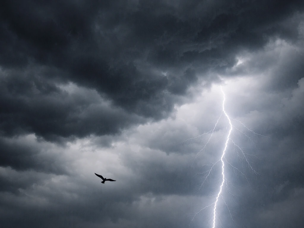 Small bird silhouette flying in a storm sky as a lightning bolt flashes behind it