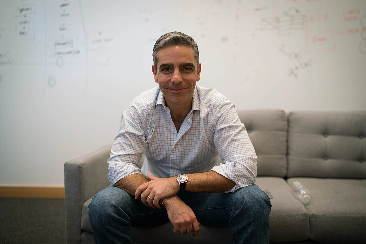 David Marcus seated on a couch in an office setting
