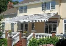 Exterior of Yankee Fireplace & Patio with striped awning