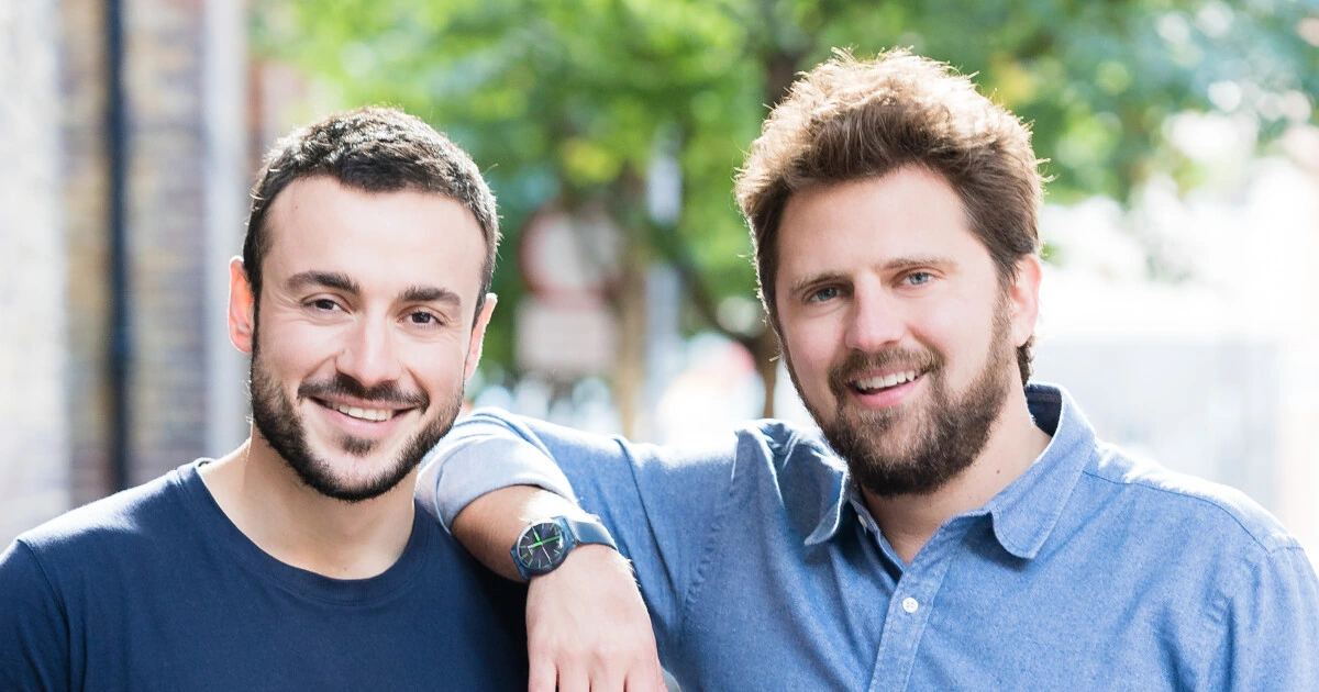 Portrait of Victor Michael Trokoudes standing beside another man outdoors