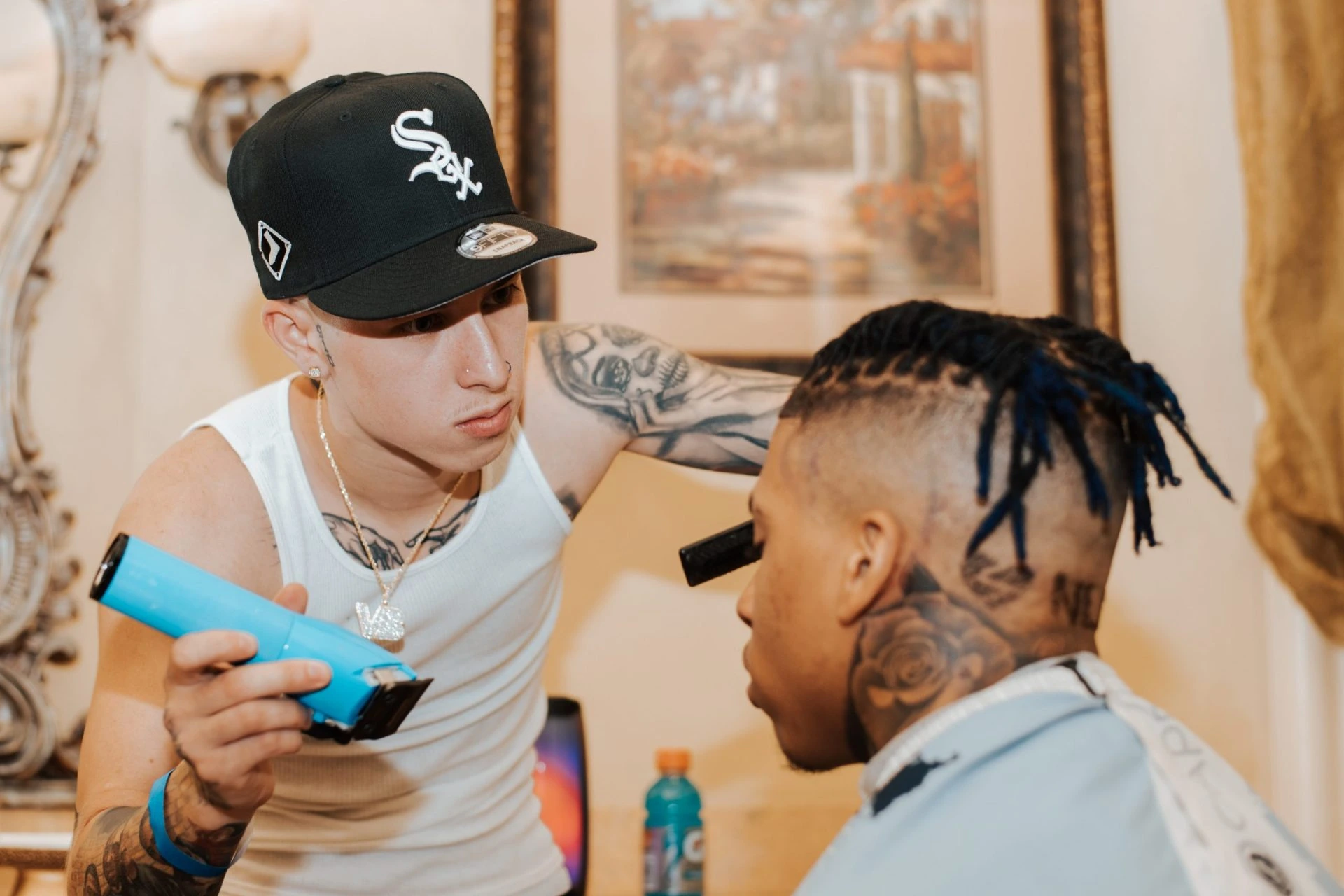 Vic Blends cutting hair in a barbering scene