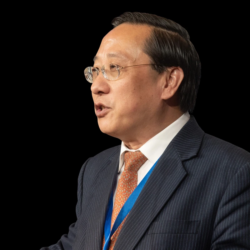 Portrait photo of Victor Zhikai Gao in a suit and tie, shown in profile against a dark background.